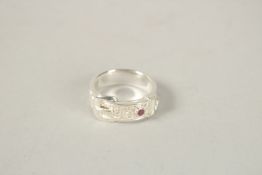 A SILVER OPAL BUCKLE RING. Ring size (Q).