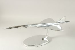 A LARGE CHROME CONCORDE in an oval base. 60cms long.