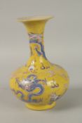 A CHINESE YELLOW GROUND ENAMELLED DRAGON VASE. 24.5cms high.