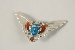 A SILVER AND ENAMEL BAT BROOCH.