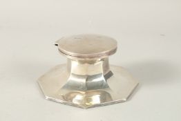 AN OCTAGONAL SILVER DESK INKWELL. 15cms. Marks rubbed.
