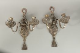 A GOOD PAIR OF OLD SHEFFIELD PLATE, TWO LIGHT WALL SCONES repousse with scrolls and acanthus. 47cm