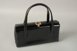A GUCCI BLACK LEATHER BAG. 11cms wide.