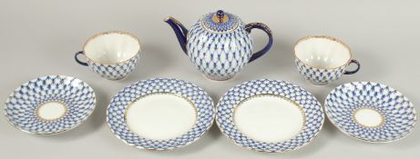 A RUSSIAN ST. PETERSBURG TEA SET, blue and gilt, comprising: tea pot and cover, two cups and saucers