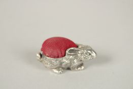 A SILVER RABBIT PIN CUSHION. 3.5cms.