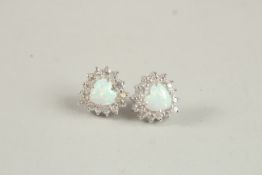 A PAIR OF SILVER CZ AND OPAL STUD EARRINGS.