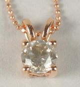 AN 18CT ROSE GOLD 4 CLAW SET SOLITAIRE DIAMOND PENDANT ON A ROSE GOLD PLATED SILVER CHAIN, boxed.