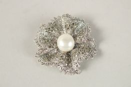 A SILVER MARCASITE AND PEARL BROOCH.