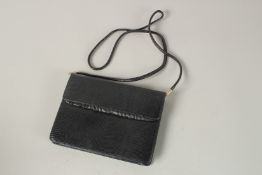 AN ASPREY'S BLACK CLUTCH BAG. 20cms wide.