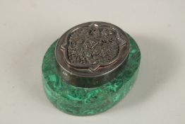 A RUSSIAN OVAL MALACHITE AND SILVER PAPERWEIGHT. 9cms x 7cms.
