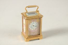 A MINI SEVRES CARRIAGE CLOCK. 6cms high.