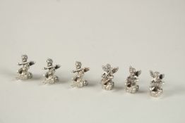 SIX SMALL CHERUB MENU HOLDERS. 2.5cms.