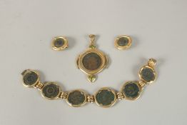 A SUITE OF GILT JEWELLERY. PENDANT, BRACELET AND EARRINGS set with replica coins.