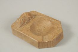 ROBERT THOMPSON, A CARVED OAK ASHTRAY. 10cms x 7cms.