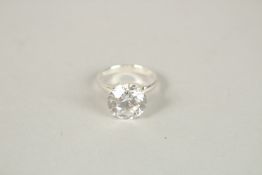 A SILVER AND LARGE CZ SOLITAIRE RING. Ring size (N).