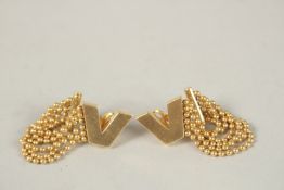 A PAIR OF VERSACE STYLE 18CT GOLD EARRINGS. 25grms.