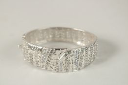 A GOOD SILVER BANGLE. 7cms x 5.5cms in a boxed Goldsmith's leather case. 42grms.