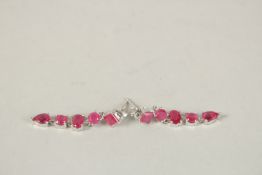 A PAIR OF SILVER FIVE STONE RUBY DROP EARRINGS.