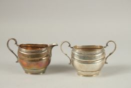 AN OVAL TWO HANDLED SUGAR BASIN AND MILK JUG. Birmingham 1916, weight: 12ozs.