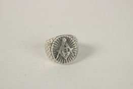 A SILVER MASONIC RING. Ring size (Q).