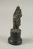 AN EARLY BRONZE MADONNA AND CHILD on a wooden base. 12cms high.