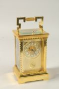 A GOOD FRENCH GILT CARRIAGE CLOCK with repeat action and alarm. 15cms high.