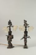 A VERY GOOD PAIR OF 19TH CENTURY FRENCH BRONZE CLASSICAL FIGURES as lamps, each with two glass
