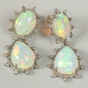 A PAIR OF VINTAGE STYLE DOUBLE DROP EARRINGS IN WHITE METAL and 14k stamped posts, set with