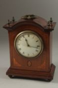 AN EDWARDIAN MAHOGANY INLAID MANTLE CLOCK. 20cm high.