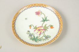 A CHINESE POLYCHROME PORCELAIN DISH. 14cms diameter.