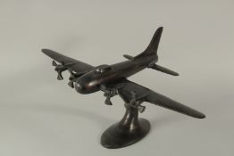 A BRONZE MODEL AEROPLANE. 22cms high.