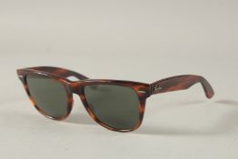 A PAIR OF RAY-BAN SUNGLASSES in a case,