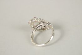 A SILVER OPAL SNAKE RING. Ring size (R).