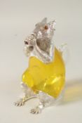 AN AMBER GILT AND SILVER PLATE NOVELTY SQUIRREL CLARET JUG.