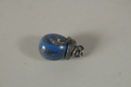 A SILVER AND LAPIS SNAKE PENDANT.