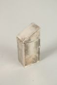 A SILVER PLATED NUDE IN A SENTRY BOX. 5cms.