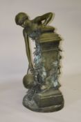 A LARGE PAINTED BRONZE GROUP OF A FEMALE FIGURE COLLECTING WATER FROM AN IVY CLAD WELL. 3ft 8ins