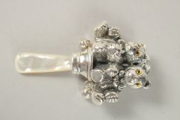 A SILVER TEDDY BEAR BABY RATTLE.