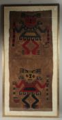A VERY RARE EARLY TEXTILE PANEL. Two native figures, framed and glazed. 140cm x 60cm.