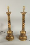 A PAIR OF CHINESE DESIGN TOLEWARE COLUMN LAMPS. 60cm high.