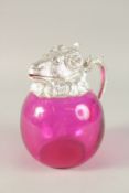A PINK GLASS AND SILVER PLATE NOVELTY RAM'S HEAD CLARET JUG. 20cms high.