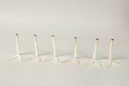 A SET OF SIX SILVER ASPREY'S SILVER FLOWER HOLDERS. 8.5cms high, in an Asprey's box. 240grms.