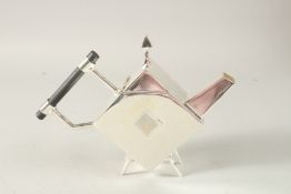 A CHRISTOPHER DRESSER DESIGN SILVER PLATED TEAPOT.