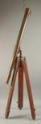 A BRASS TELESCOPE ON A STAND.