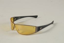 A PAIR OF INDIAN SUNGLASSES in a case.