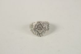 A SILVER MASONIC RING. Ring size (S).