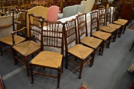 A GOOD MATCHED SET OF TWELVE LANCASHIRE SPINDLE BACK ASH AND RUSH SEATED DINING CHAIRS, two with