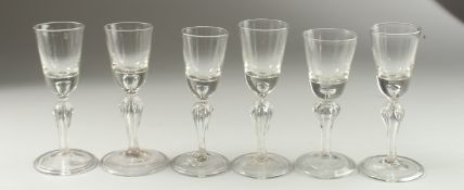 A SET OF SIX FUNNEL BOWL GLASSES on fold feet. 15cm high.