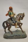 A GOOD LARGE BRONZE AND PAINTED BRONZE GROUP OF AN ARAB HUNTER ON HORSEBACK. 4ft high x 3ft 2ins