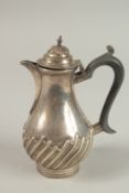 A SMALL VICTORIAN SILVER WRYTHEN FLUTED JUG with wooden handles. London 1895, weight: 7ozs.